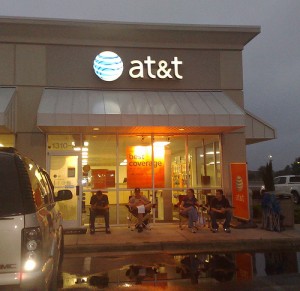 att-store Customers reserve spots outside an AT&T store for the release of a new iPhone, which has contributed to a 20,000 percent increase in data traffic on AT&T's networks since 2007.